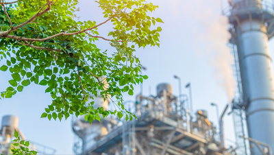 power plant with tree in foreground cropped